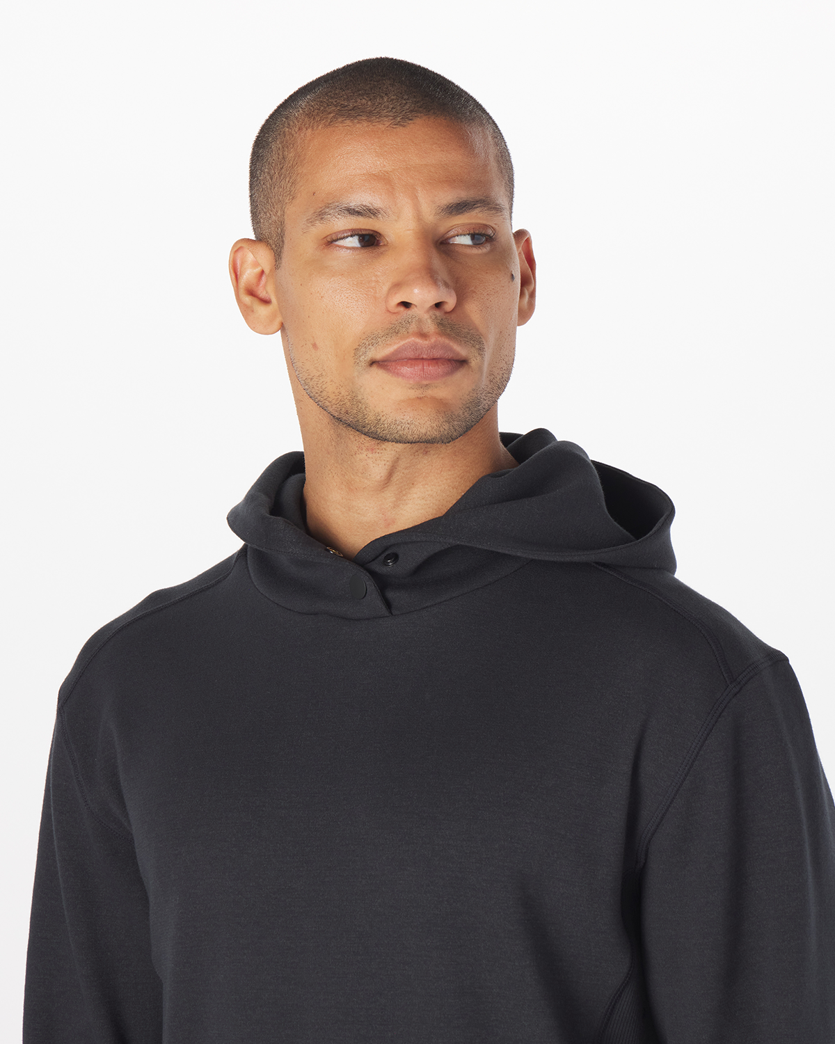 Black hoodie with drawstring, shown on a model wearing it against a white background.