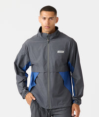 Charcoal and blue full-zip jacket with stand collar and color-block design on sleeves.