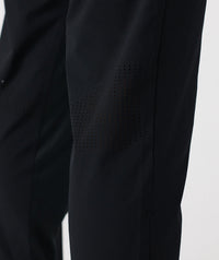 Black pant with textured fabric and perforated ventilation panel on thigh.