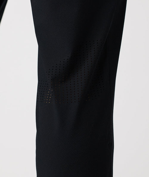 Black pant with perforated mesh panels along the thighs and lower legs.