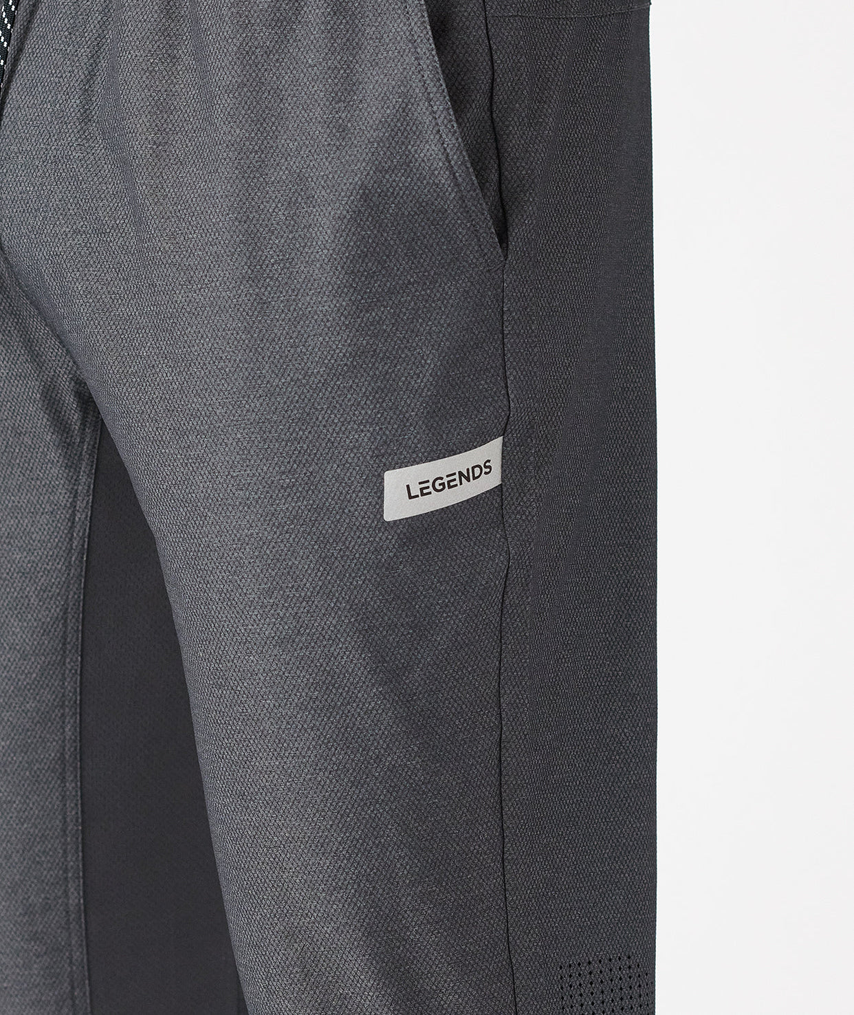 Charcoal gray pants with textured fabric and "Legends" brand label on thigh.