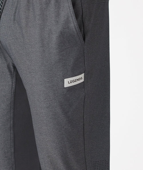Charcoal gray pants with textured fabric and "Legends" brand label on thigh.