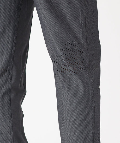 Charcoal gray pants with textured weave fabric and perforated detail on thigh.