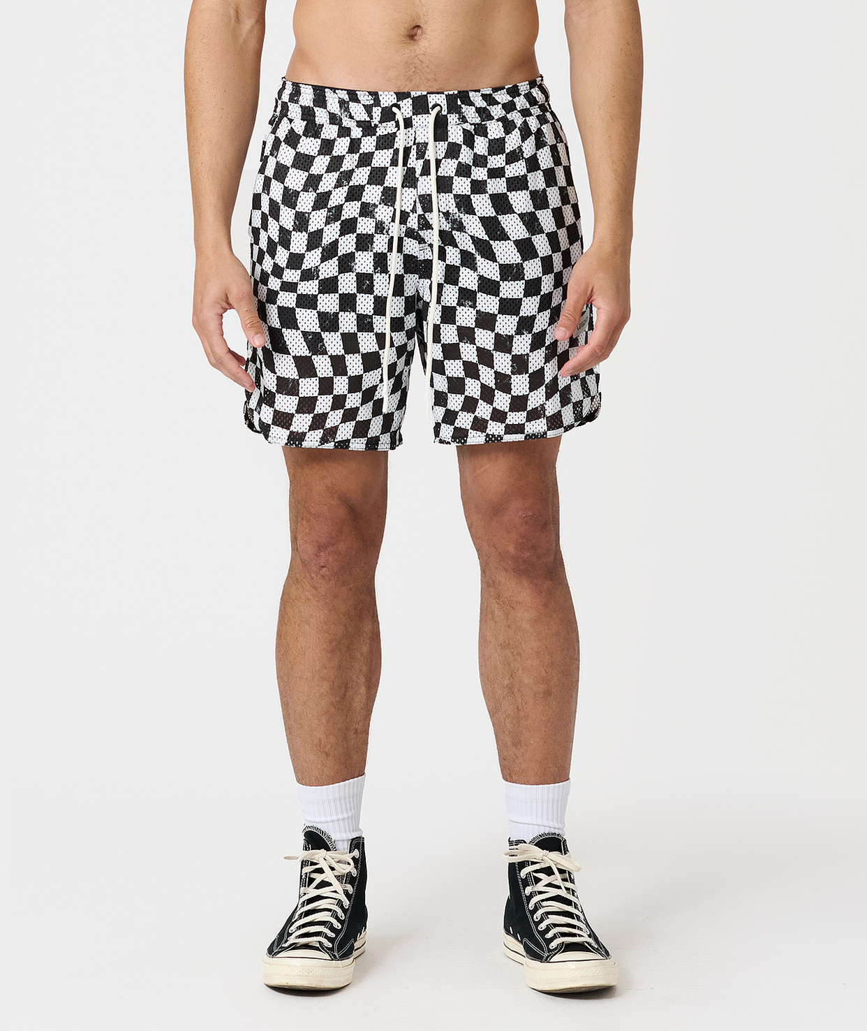 Men's mesh shorts with warped black and white checkerboard pattern and drawstring waist.