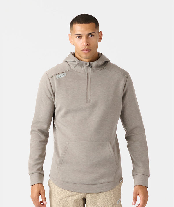 Taupe heather quarter zip hoodie with front kangaroo pocket and brand label on shoulder.