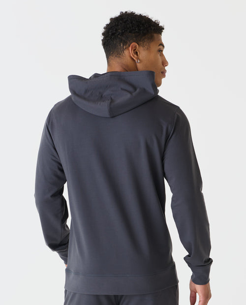 Charcoal gray pullover hoodie with drawstring hood, shown from back on model.